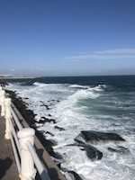 A coastal scene from Mar del Plata showing waves crashing on the shore.