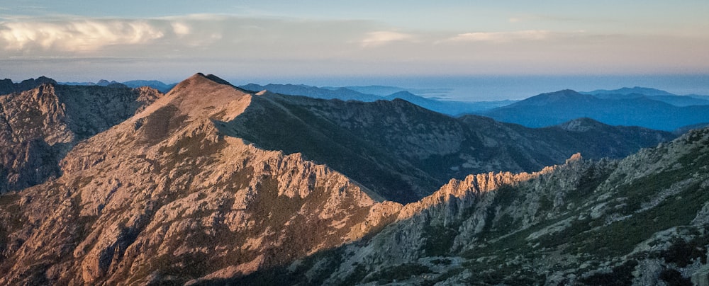 brown and gray mountains under blue sky during daytime