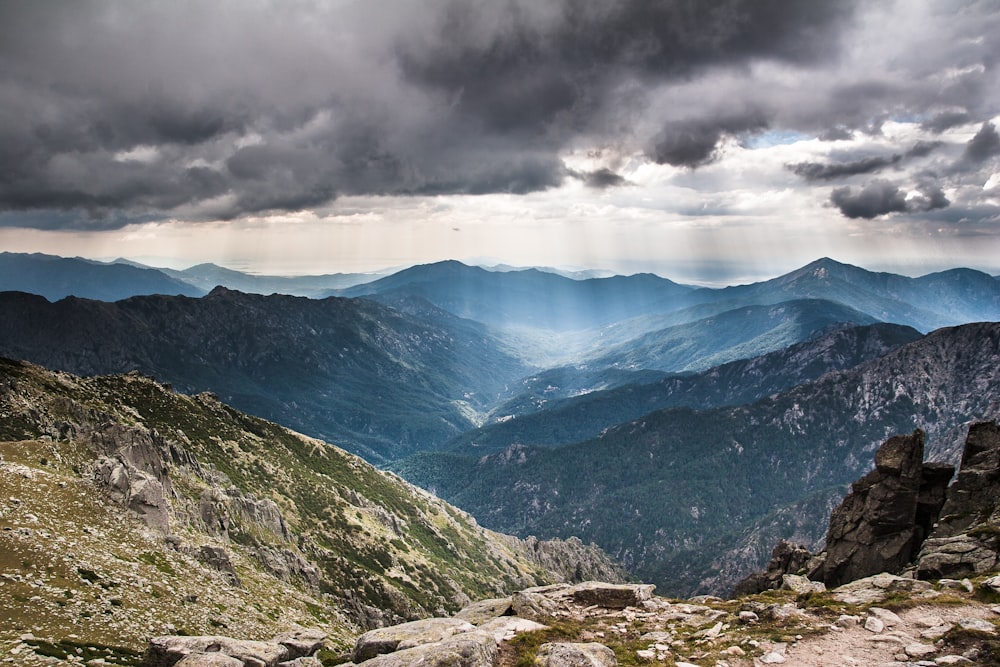 green mountains under white clouds during daytime