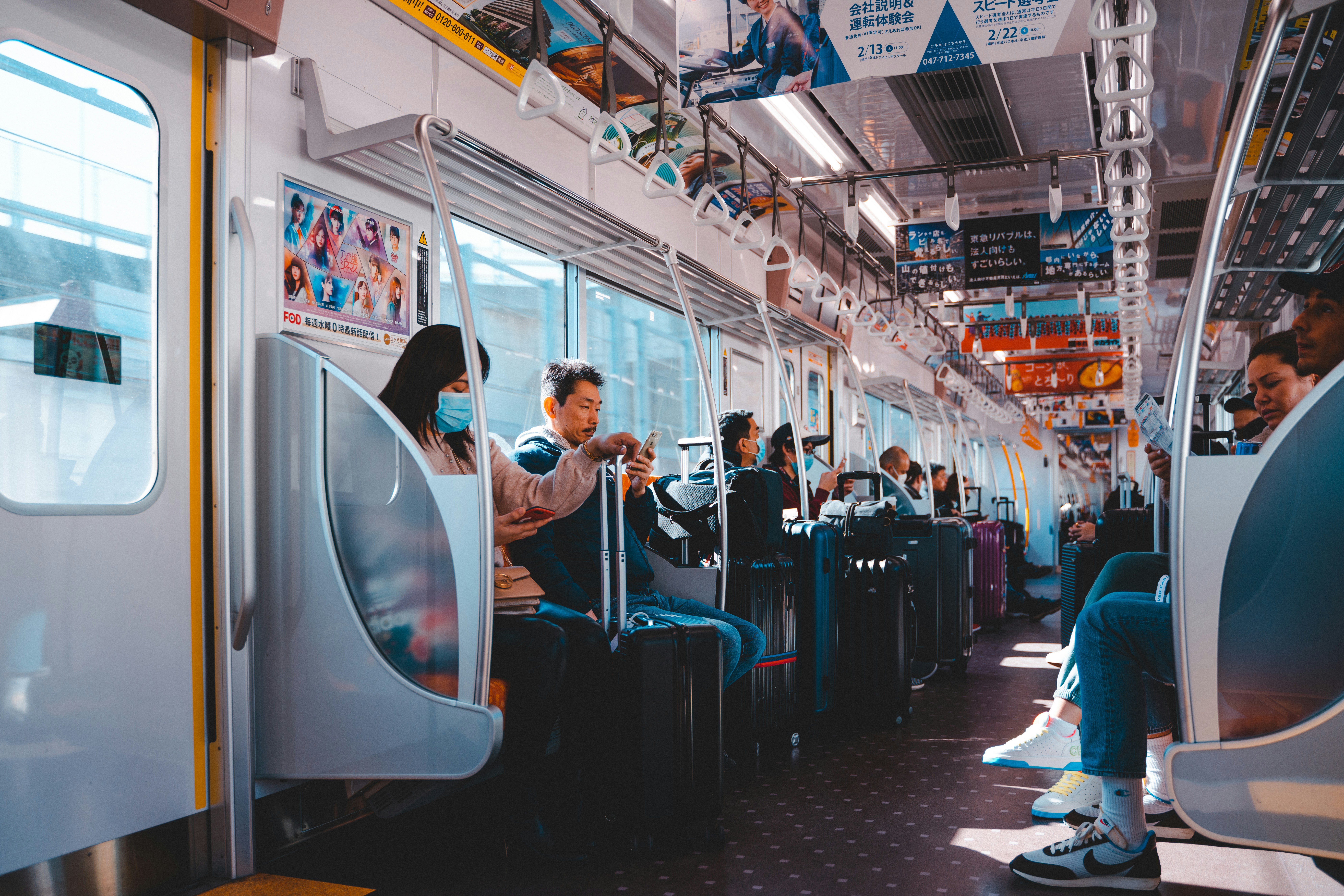 people in train during daytime