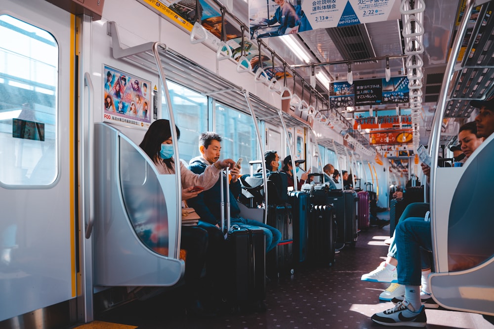 people in train during daytime