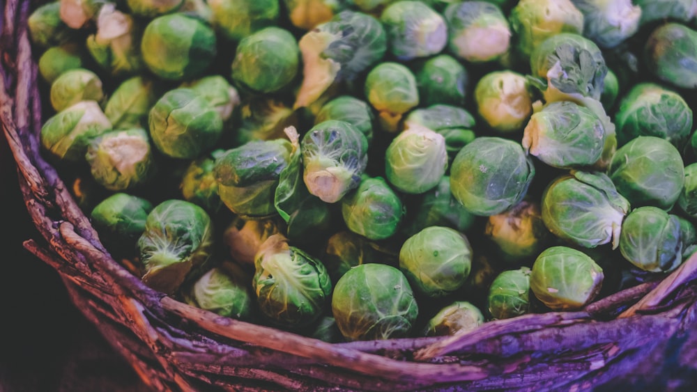 green and yellow vegetable on brown woven basket