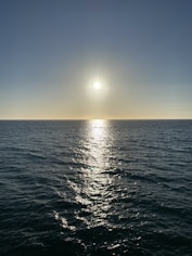 body of water during sunset