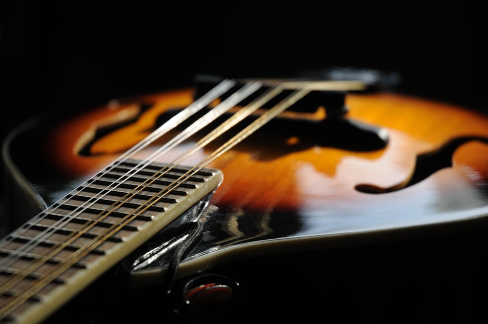 brown and black electric guitar