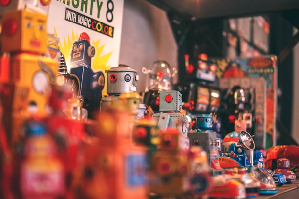 A colorful display of various robot series collectible toys arranged on shelves