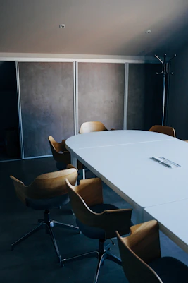 white wooden table with chairs