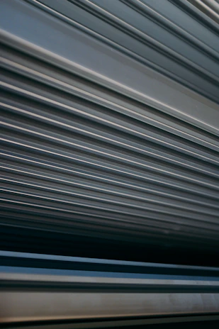 Close-up of a commercial rolling shutter’s interlocking slats showing fine texture and robust build.