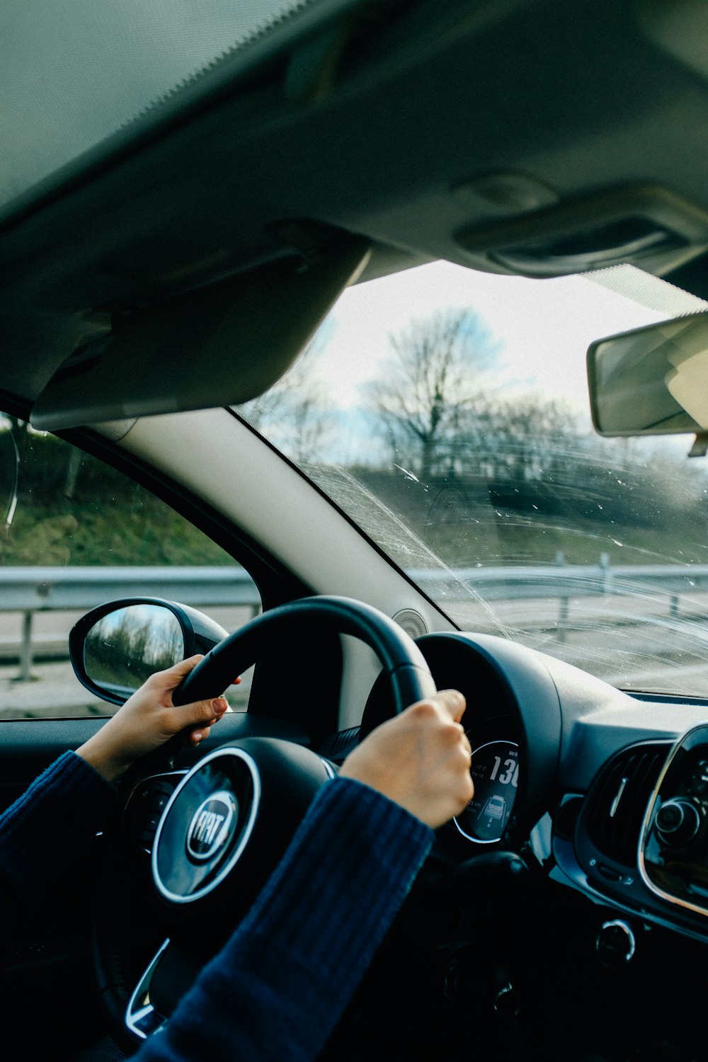 person driving car during daytime