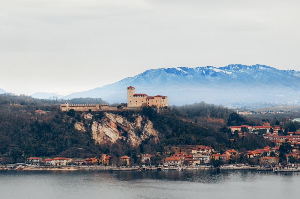 brown concrete building near body of water during daytime