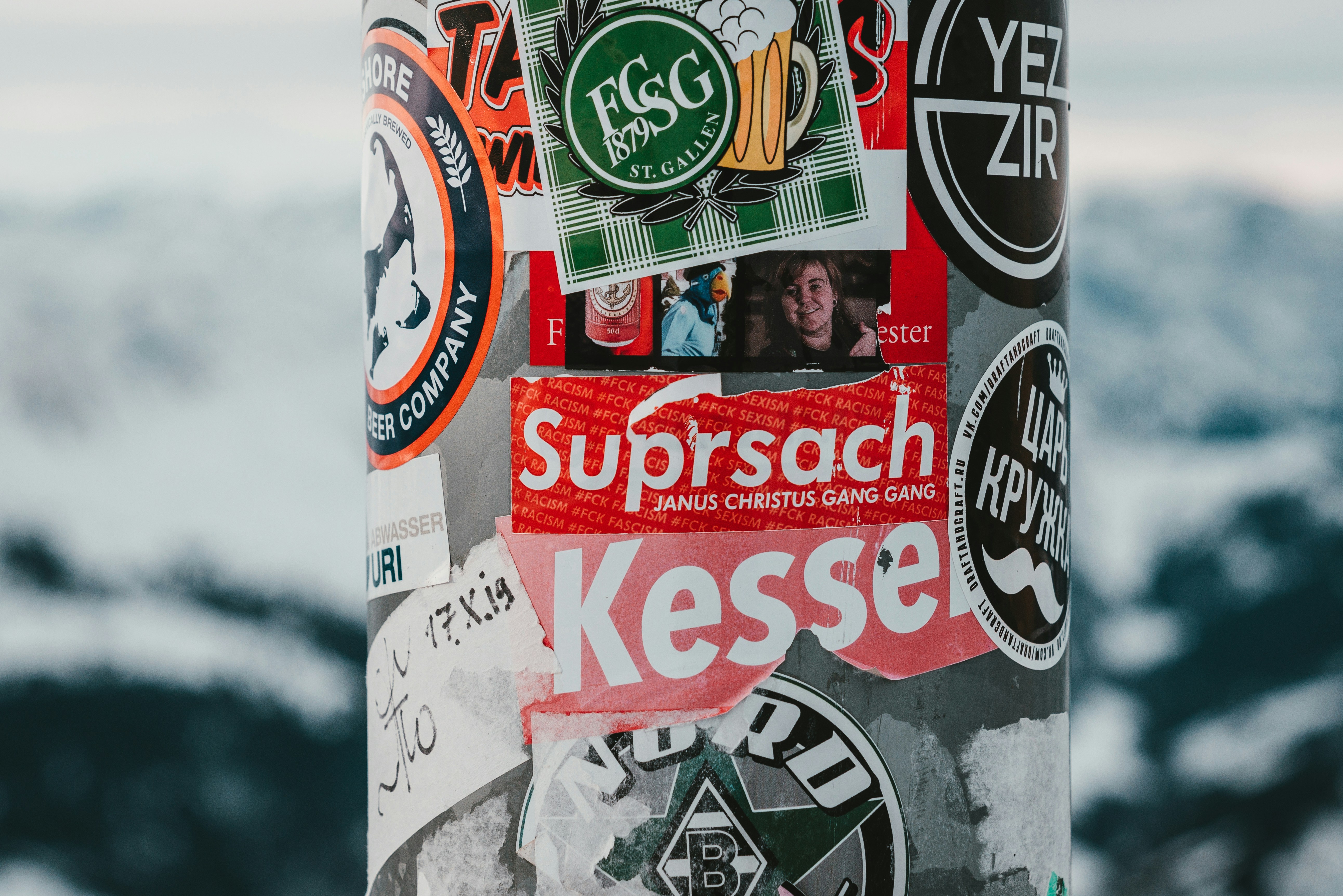 a snowboard with stickers all over it