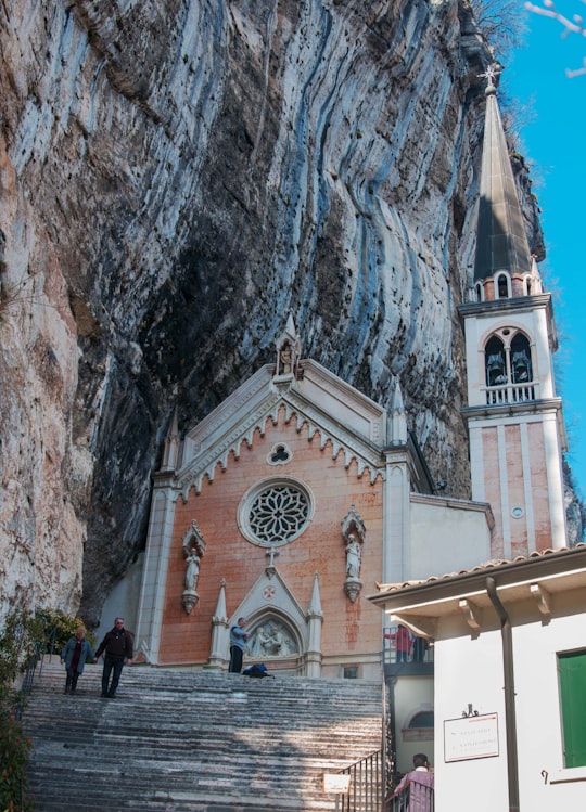 white and brown concrete building in Via Madonna della Corona Italy