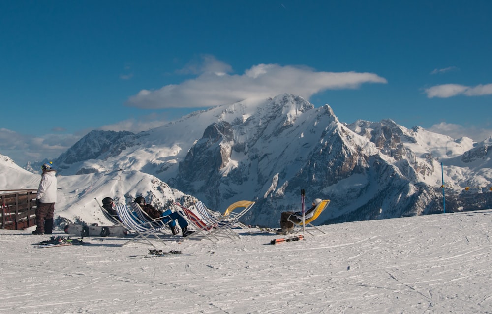 white and blue boat on snow covered mountain during daytime