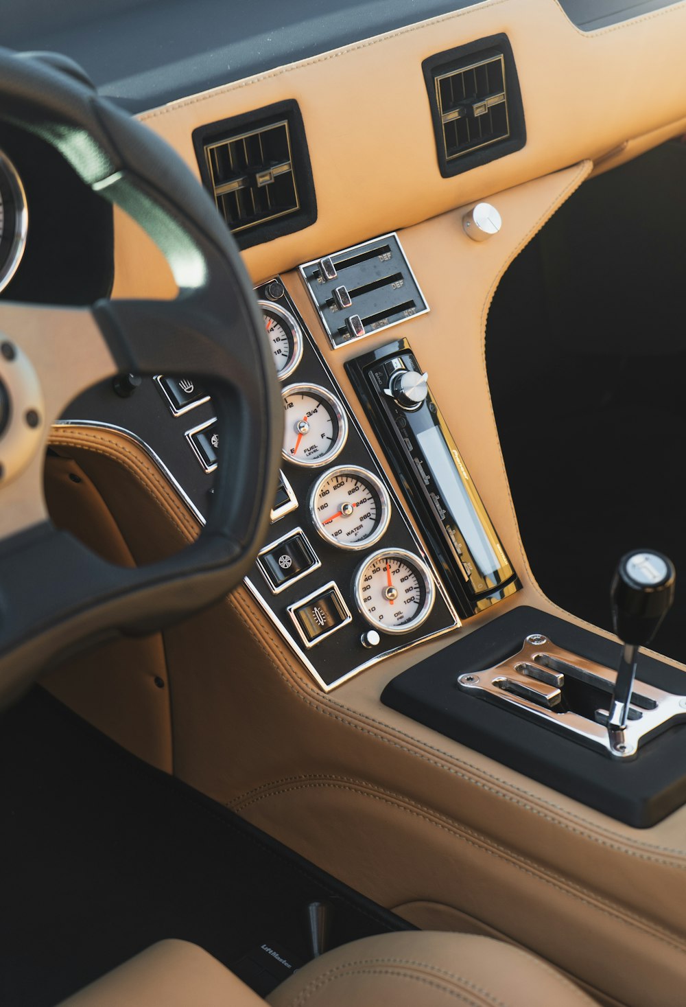 black and brown car steering wheel