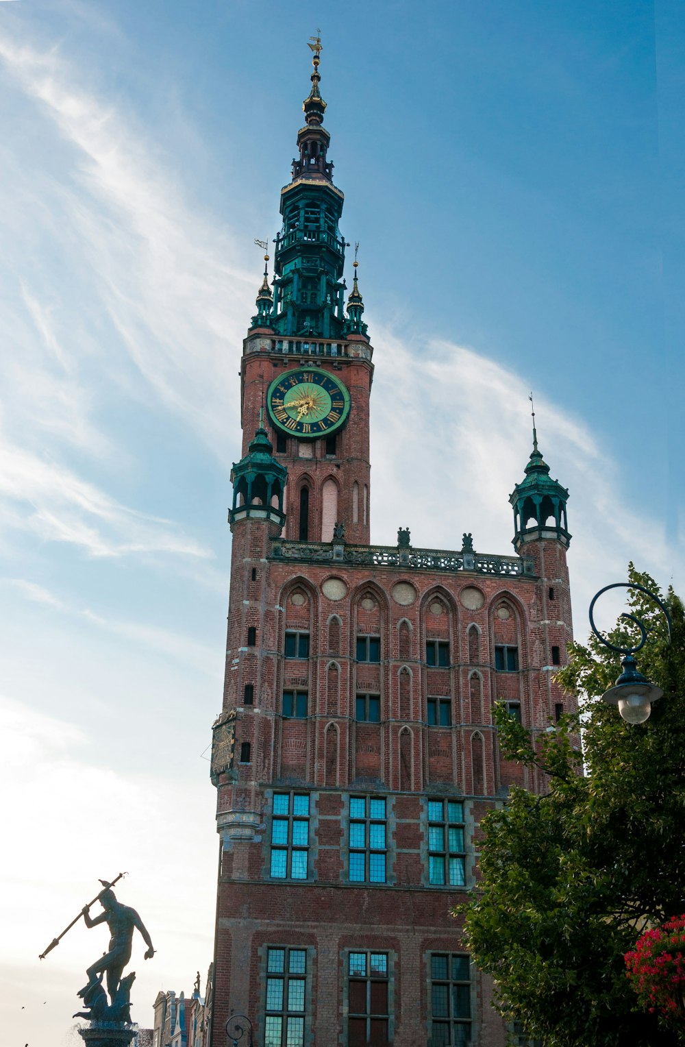 brown and green concrete building under blue sky during daytime