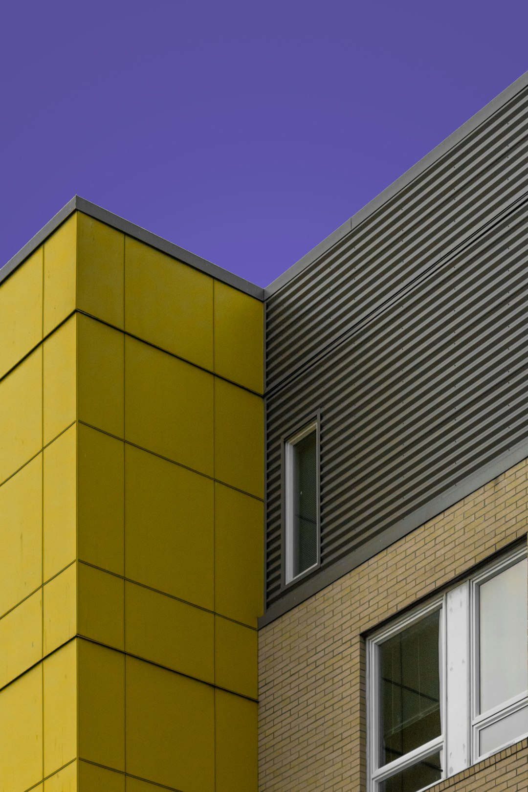 yellow concrete building under blue sky during daytime