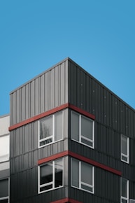 white and red concrete building under blue sky during daytime