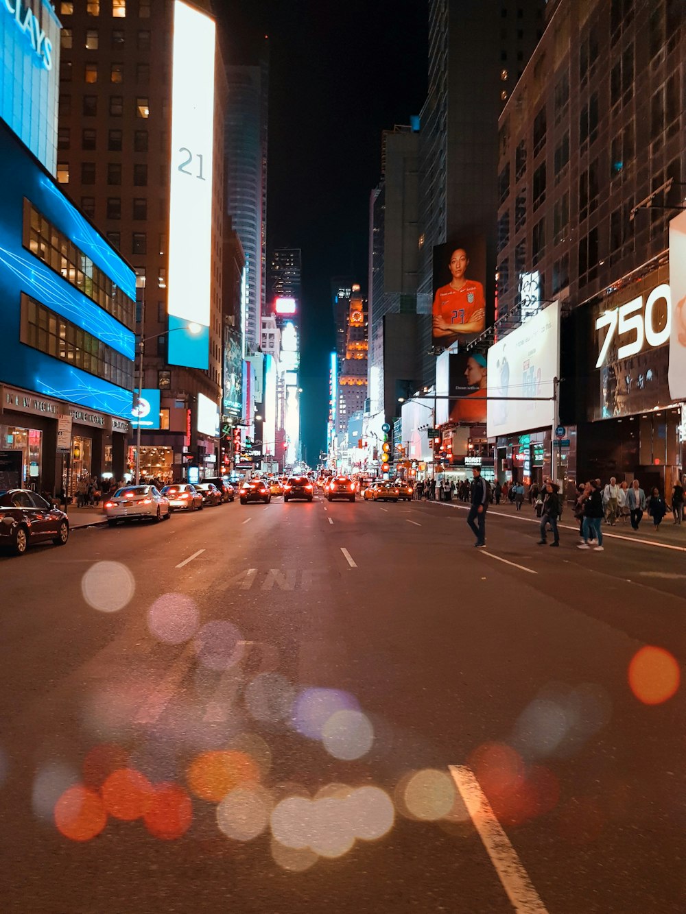 people walking on street during night time