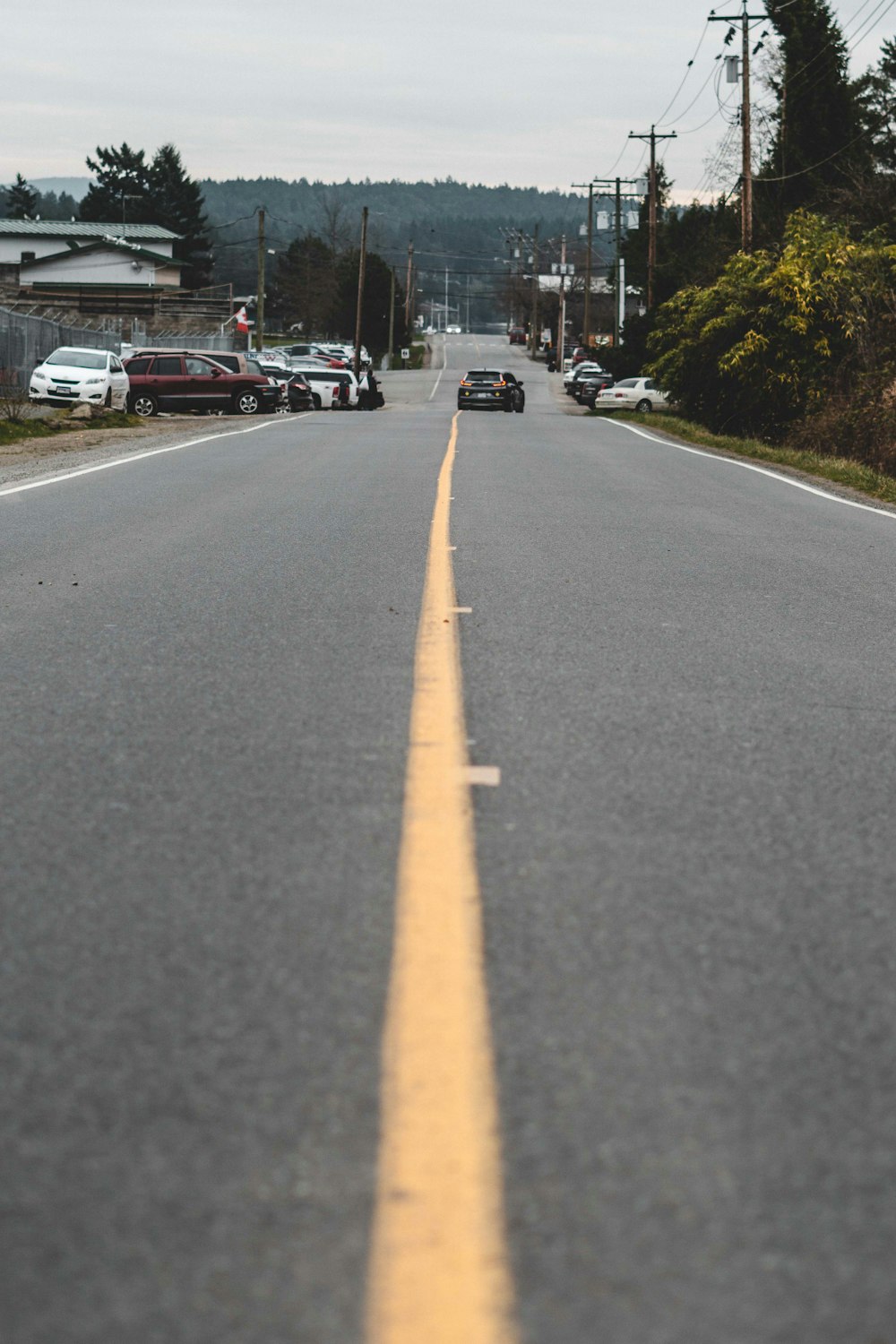 a long yellow line on the side of a road