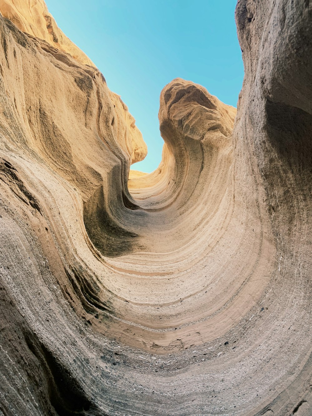 brown rock formation under blue sky during daytime