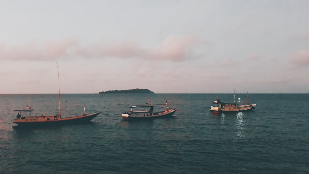 red and white boat on sea during daytime