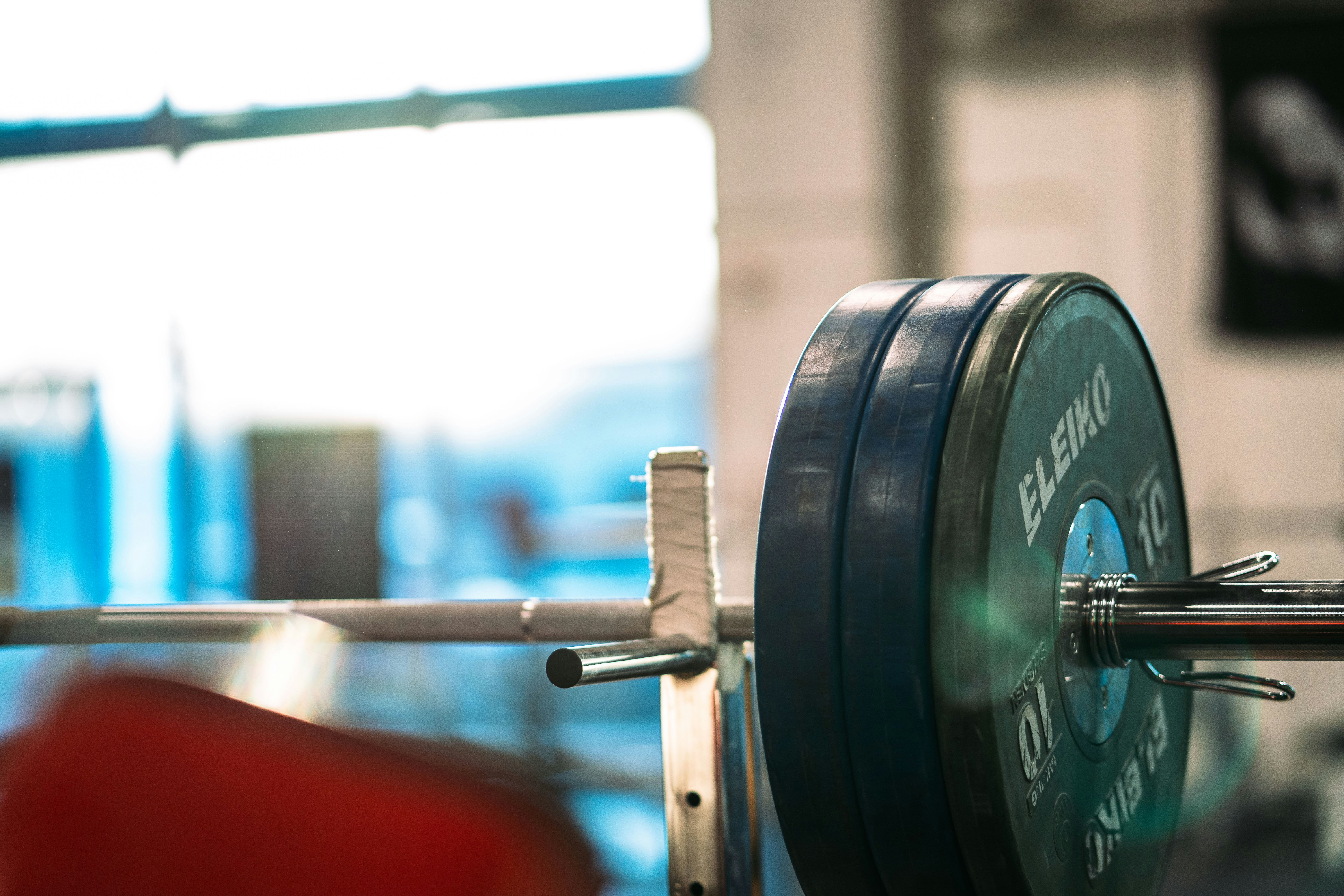 black and gray barbell bar