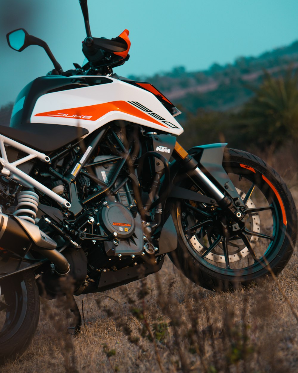 white orange and black sports bike