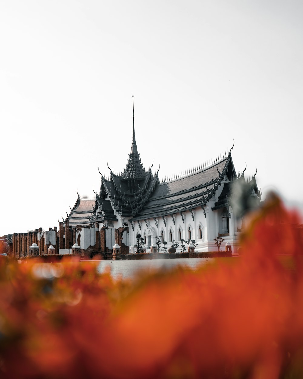 white and green temple under white sky during daytime