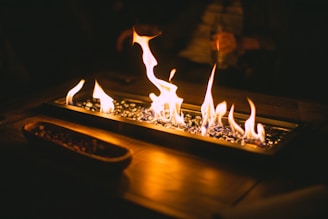 fire on brown wooden table