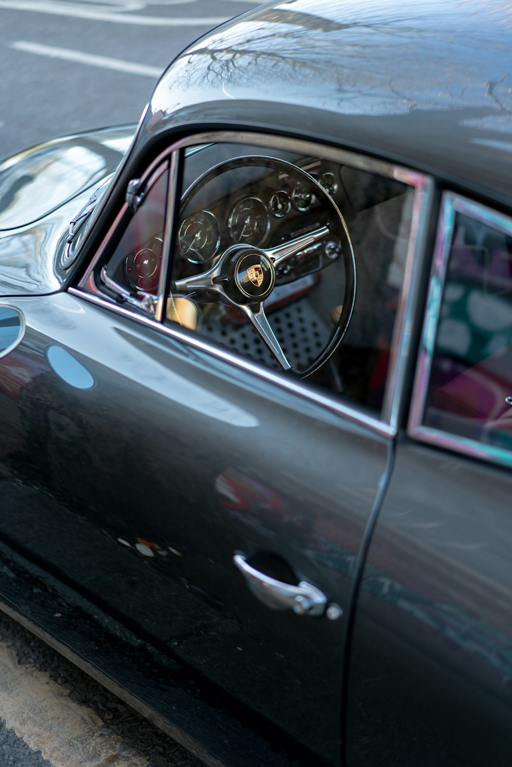 black car with silver steering wheel