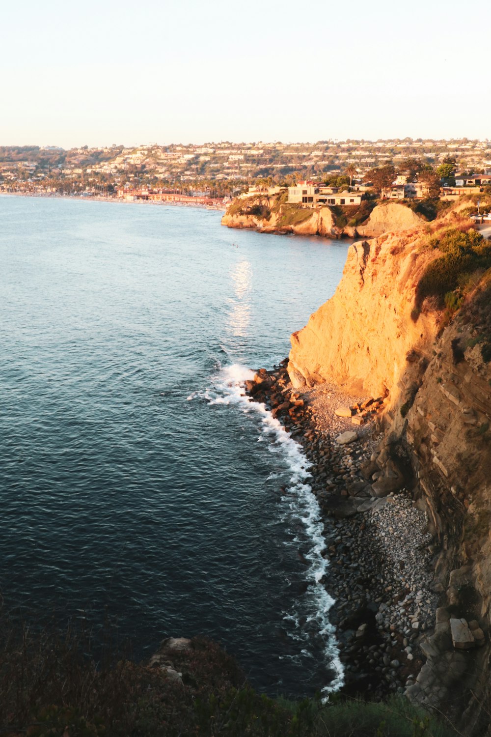 brown rock formation beside blue sea during daytime