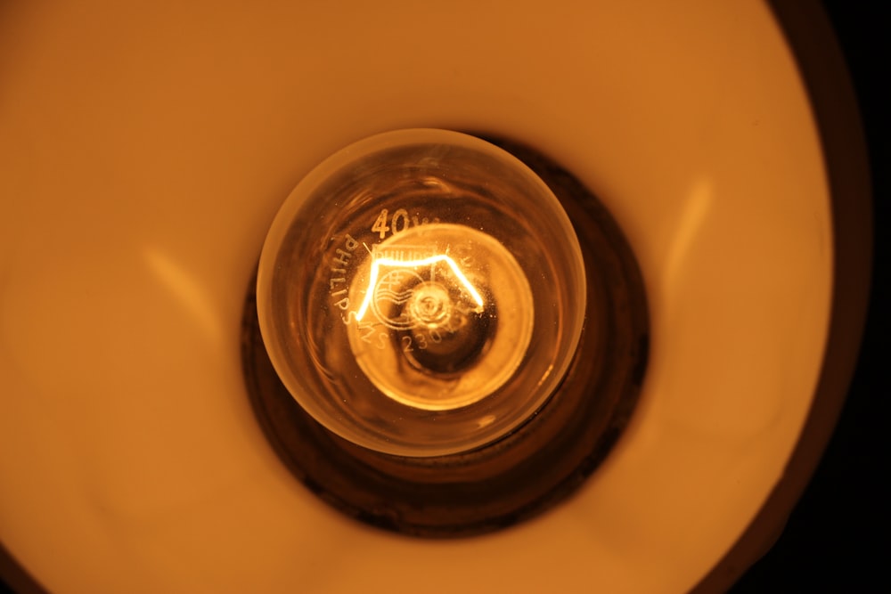 clear drinking glass on white ceramic sink