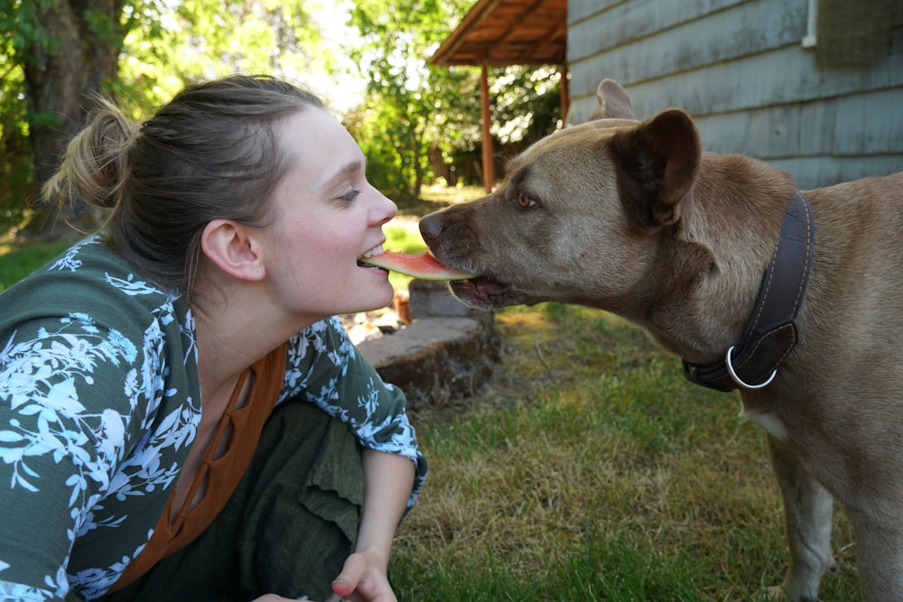 girl in blue and white floral shirt eating ice cream