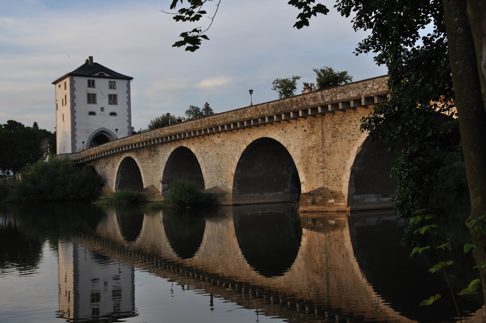 brown concrete bridge over river