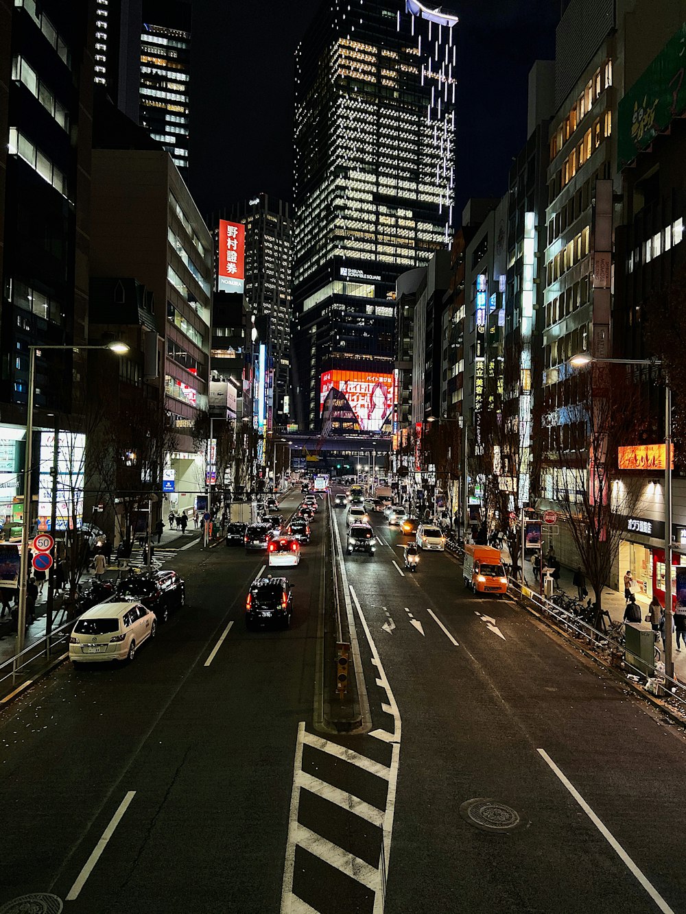 cars on road in city during night time