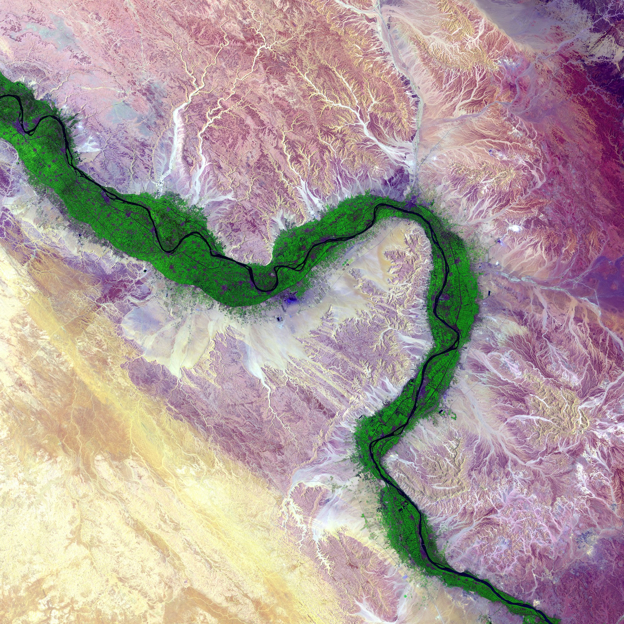 It is easy to see from this image why people have been drawn to the Nile River in Egypt for thousands of years. Green farmland marks a distinct boundary between the Nile floodplain and the surrounding harsh desert.