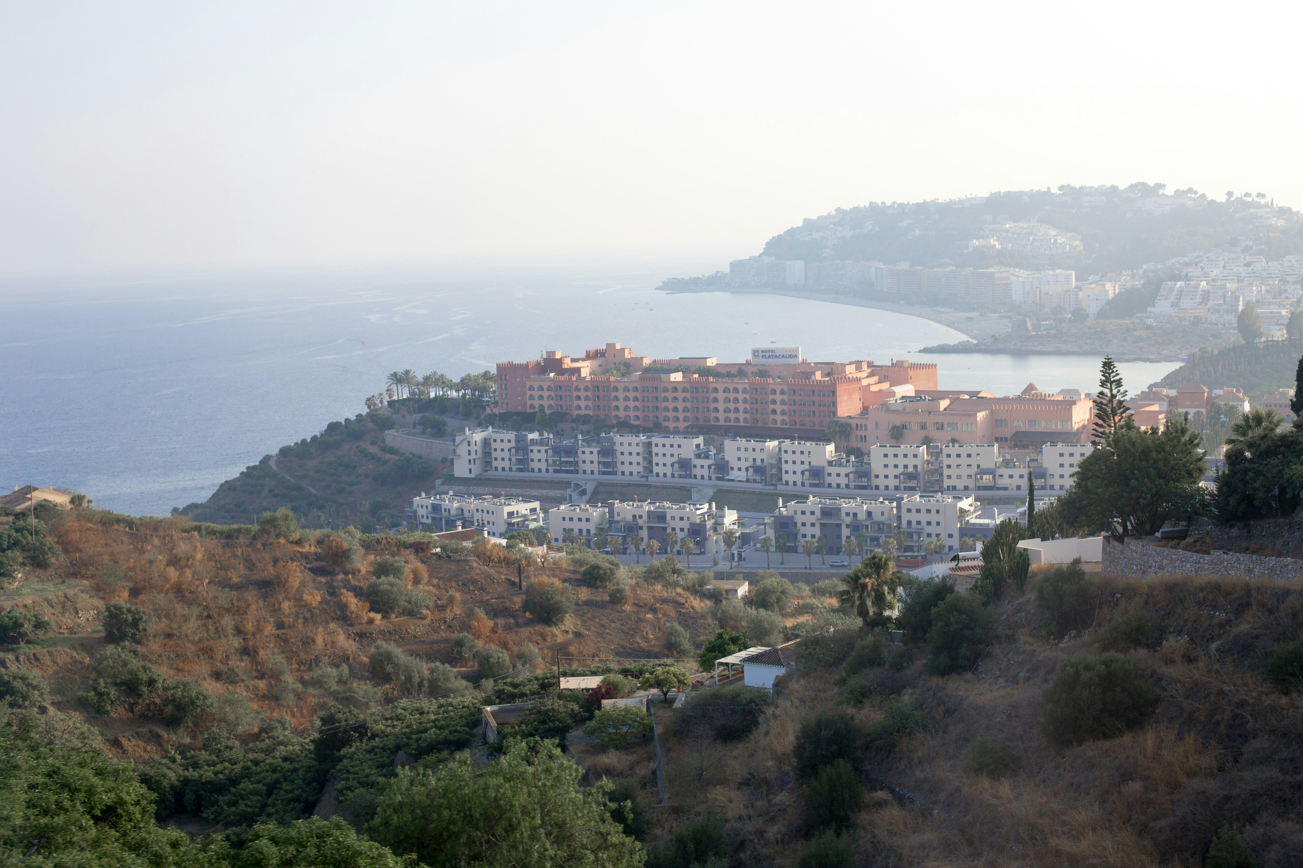 city buildings on top of mountain during daytime