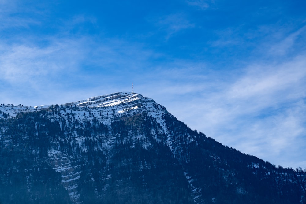 white and black mountain under blue sky during daytime