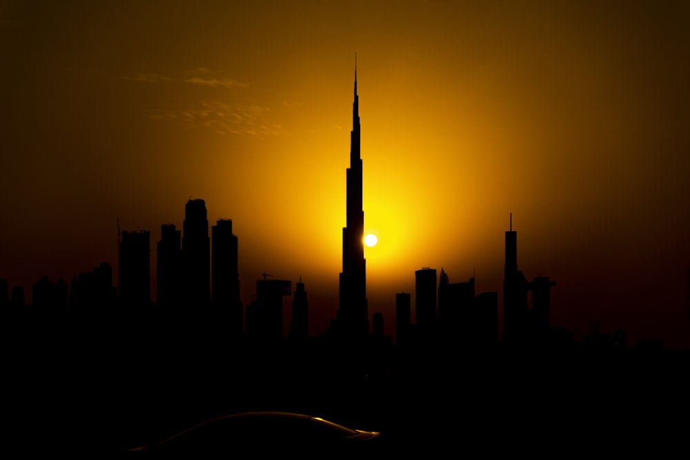 silhouette of city skyline during sunset