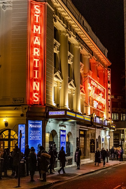 London West End theatre district at night with illuminated buildings