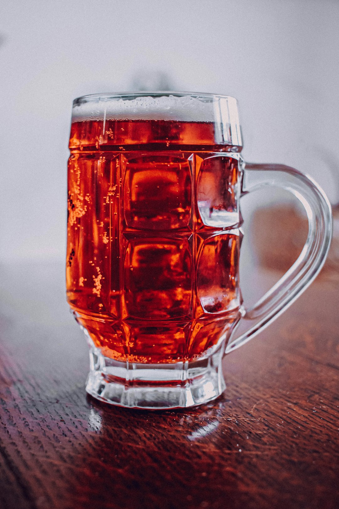 clear glass mug with brown liquid