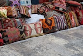 A selection of cozy blankets and cushions.