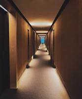 A serene hospital corridor with soft blue and green accents, inviting calm and trust.