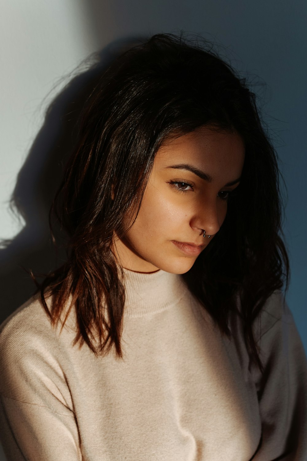 woman in white turtleneck shirt