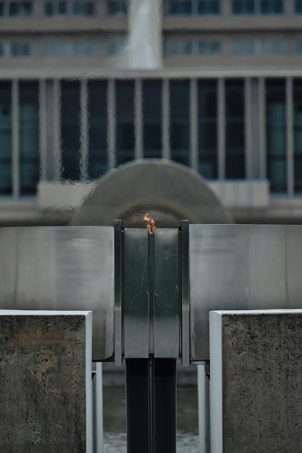 grey concrete building with green metal door