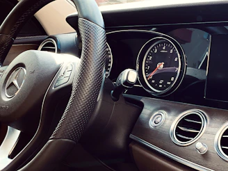 Close-up of a Mercedes car dashboard during maintenance at the workshop