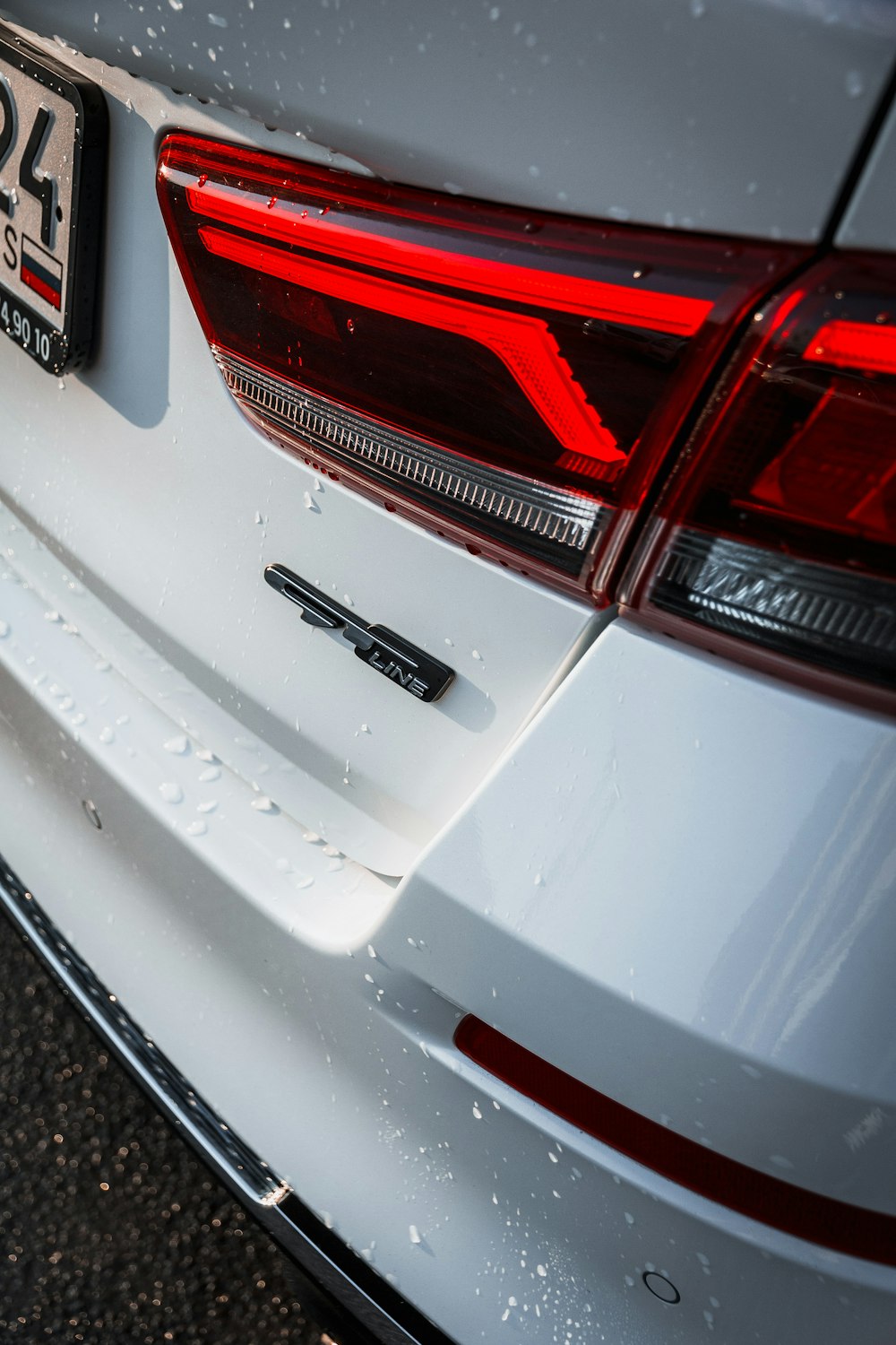 white and red car with license plate