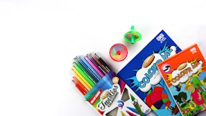 assorted color coloring pencils on white table