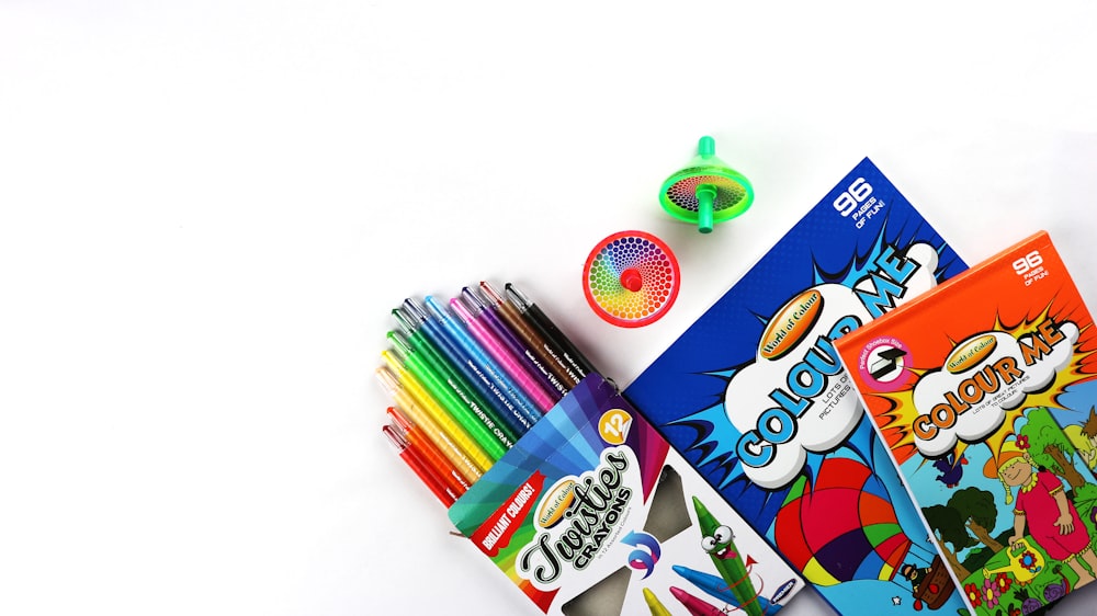 assorted color coloring pencils on white table