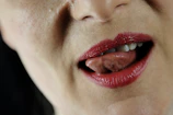 Close-up of a woman’s lips with a subtle, inviting smile.