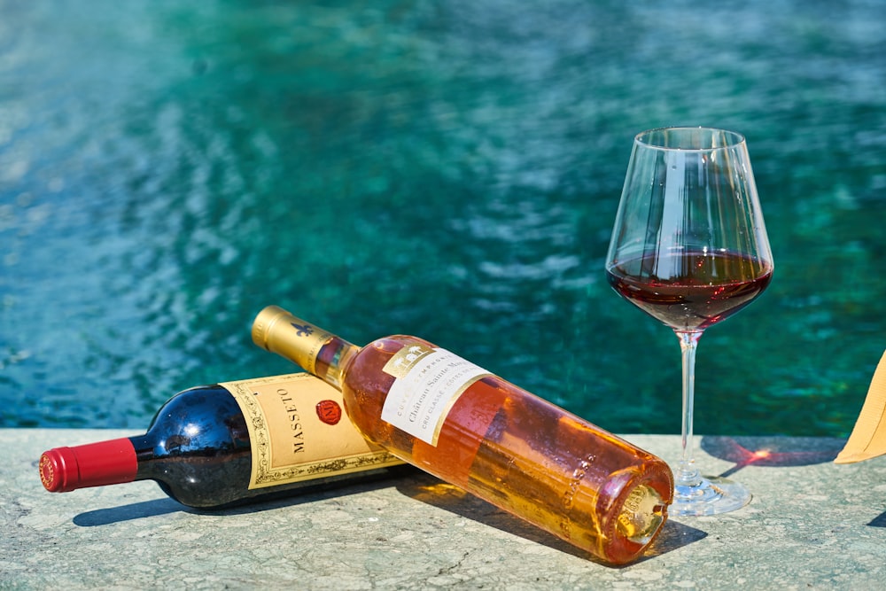 wine bottle and wine glass on table